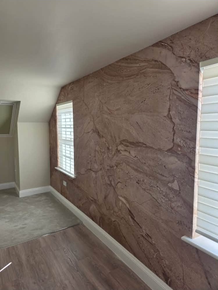 Bedroom with a stone effect feature wall