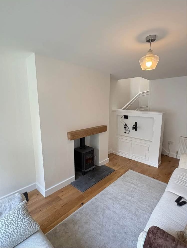 White chimney breast alcove with a stove